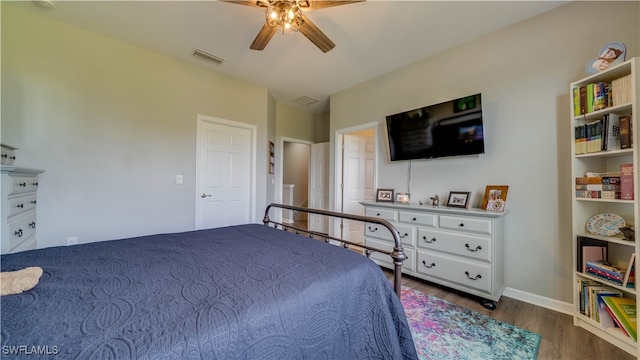 bedroom featuring hardwood / wood-style flooring and ceiling fan