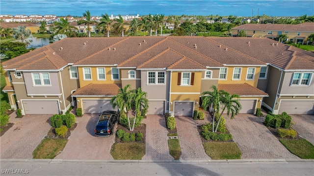 view of front of house with a water view