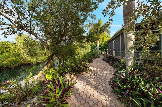 view of yard with a sunroom