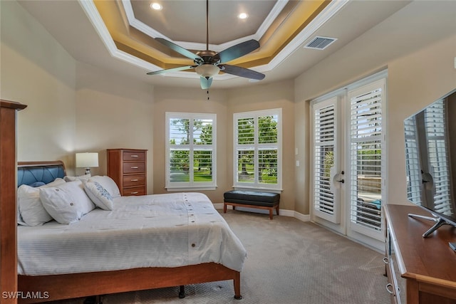 bedroom featuring a raised ceiling, crown molding, ceiling fan, access to exterior, and light colored carpet