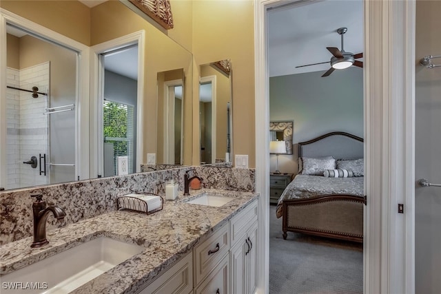 bathroom featuring ceiling fan, vanity, and tiled shower