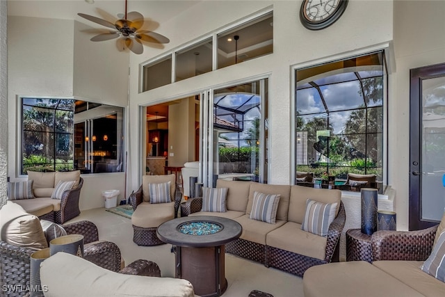 interior space with an outdoor hangout area, ceiling fan, and a lanai