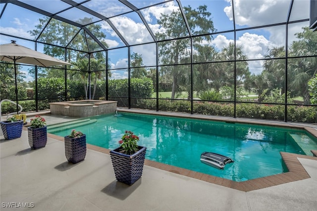 view of pool with glass enclosure, a patio area, and an in ground hot tub