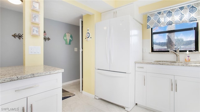 bathroom featuring sink and tile patterned flooring