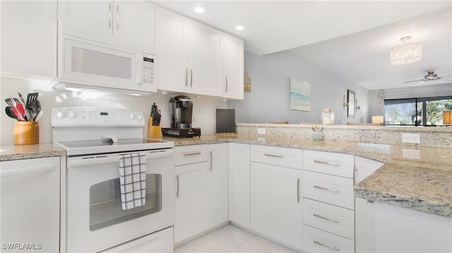 kitchen featuring ceiling fan, white cabinetry, light stone counters, and white appliances