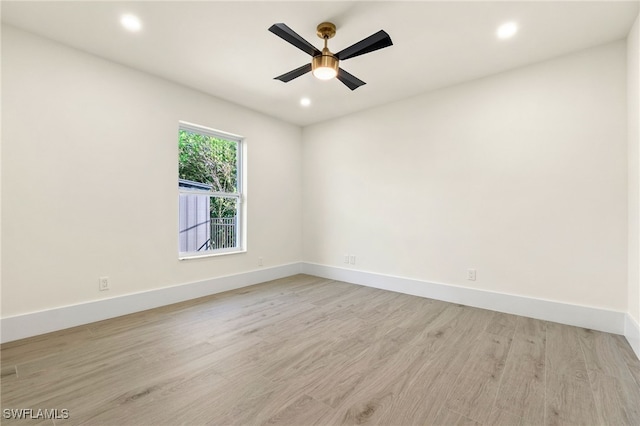 unfurnished room with ceiling fan and light hardwood / wood-style floors