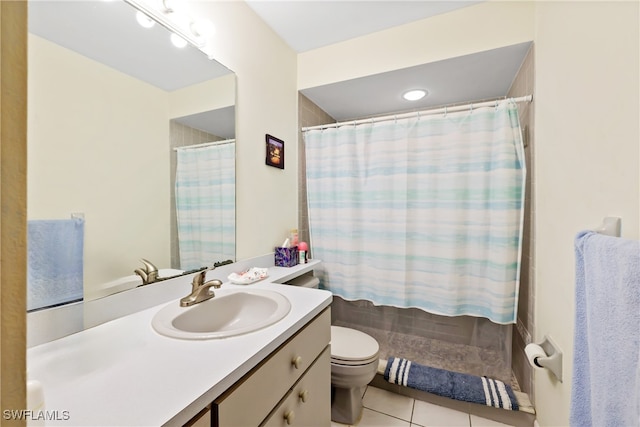 bathroom with tile patterned flooring, a shower with curtain, vanity, and toilet