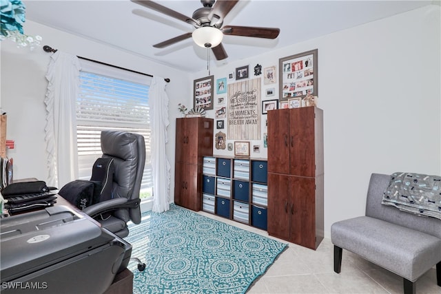 tiled office featuring ceiling fan