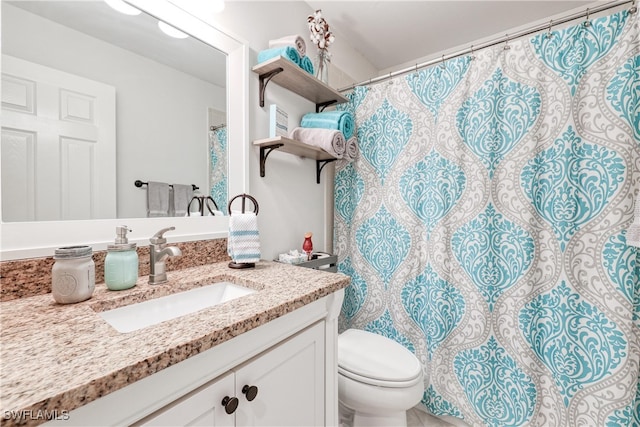 1140 Sarah Jean Cir Unit C-205, Naples, FL 34110 - full bathroom featuring toilet, a shower with shower curtain, and vanity