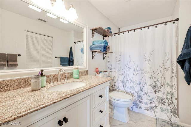 1140 Sarah Jean Cir Unit C-205, Naples, FL 34110 - bathroom featuring toilet, vanity, curtained shower, visible vents, and tile patterned floors