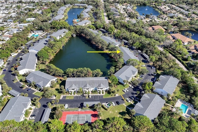 birds eye view of property featuring a water view