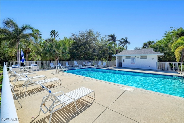 view of swimming pool featuring a patio area