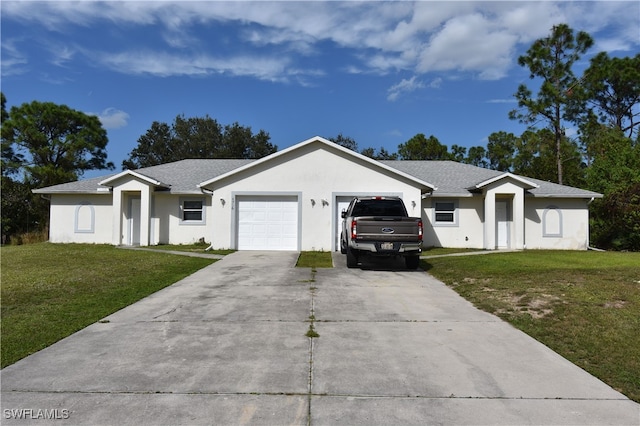 ranch-style house featuring a garage and a front lawn