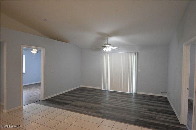 empty room with lofted ceiling, ceiling fan, and light hardwood / wood-style flooring