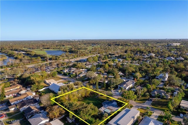 1303 Trail Terrace Dr, Naples, FL 34103 - aerial perspective of suburban area with property boundaries highlighted and a large body of water