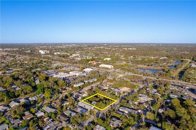 1303 Trail Terrace Dr, Naples, FL 34103 - view of property location with property boundaries highlighted, a large body of water, and nearby suburban area