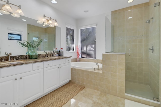 bathroom featuring tile patterned floors, vanity, and plus walk in shower