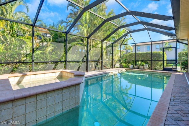 view of pool featuring a lanai and sink