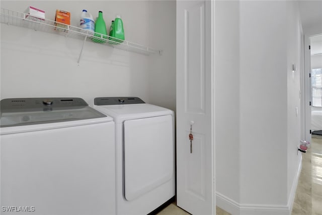 laundry room with separate washer and dryer