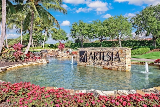 community sign with a water view