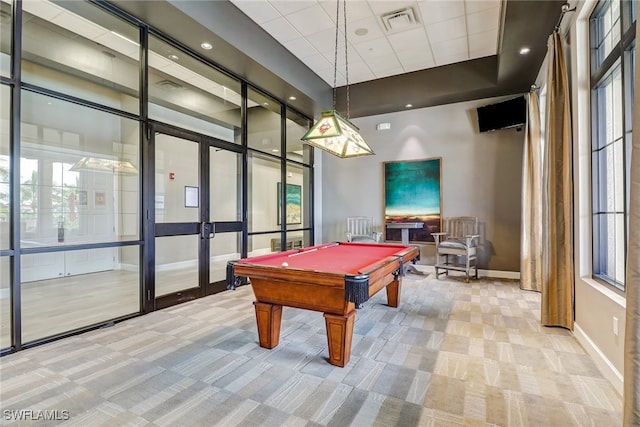 recreation room featuring french doors, light colored carpet, plenty of natural light, and pool table