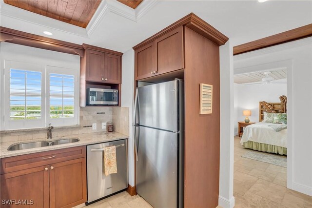 kitchen with stainless steel appliances, sink, a raised ceiling, light stone countertops, and wood ceiling