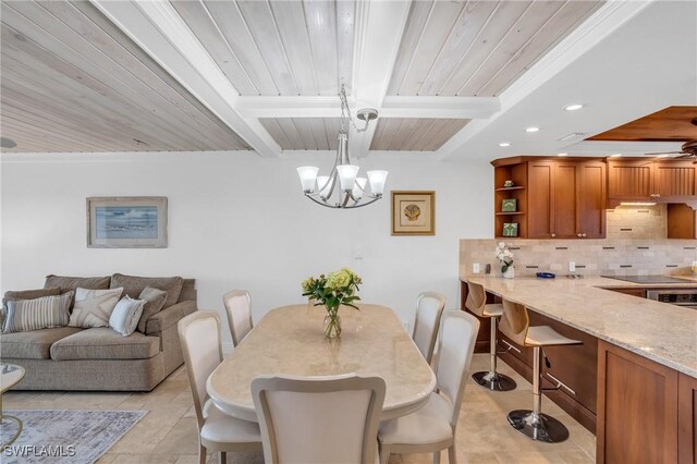 dining area with beamed ceiling, a notable chandelier, wood ceiling, and light tile patterned floors