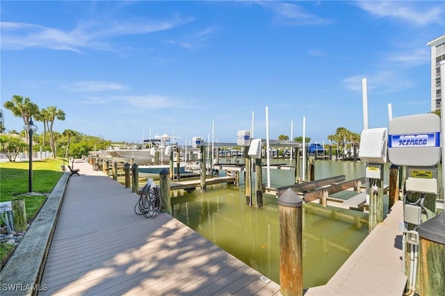 dock area with a water view and boat lift