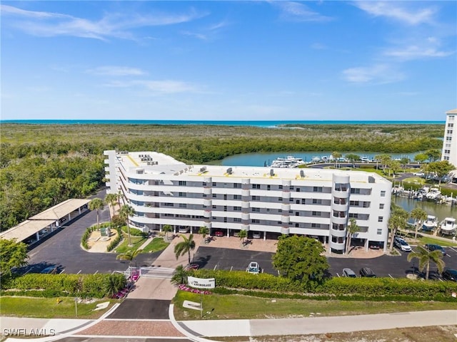 birds eye view of property featuring a water view