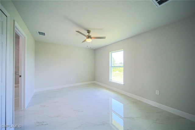 spare room with ceiling fan