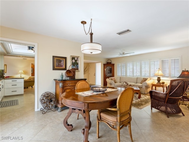 dining area featuring ceiling fan and light tile patterned floors