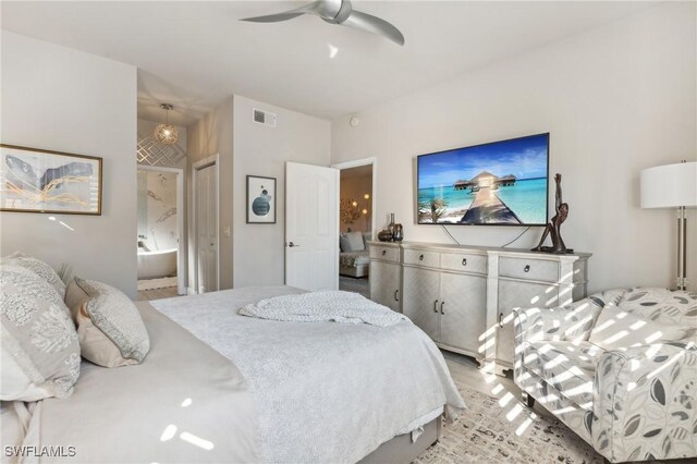 bedroom with ceiling fan and ensuite bathroom