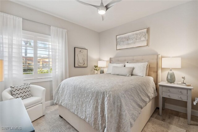 bedroom featuring ceiling fan and light hardwood / wood-style flooring