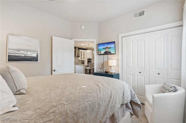 bedroom featuring a closet and visible vents