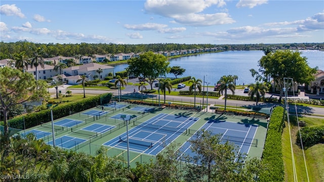 drone / aerial view featuring a water view and a residential view