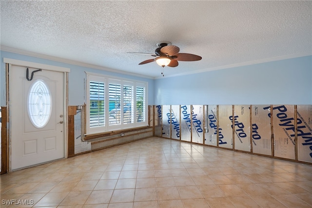 entrance foyer featuring a textured ceiling, ceiling fan, and crown molding