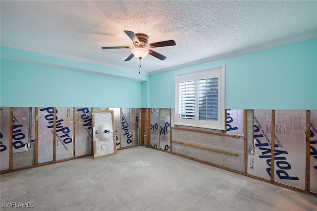 unfurnished room with concrete flooring, a textured ceiling, ceiling fan, and crown molding