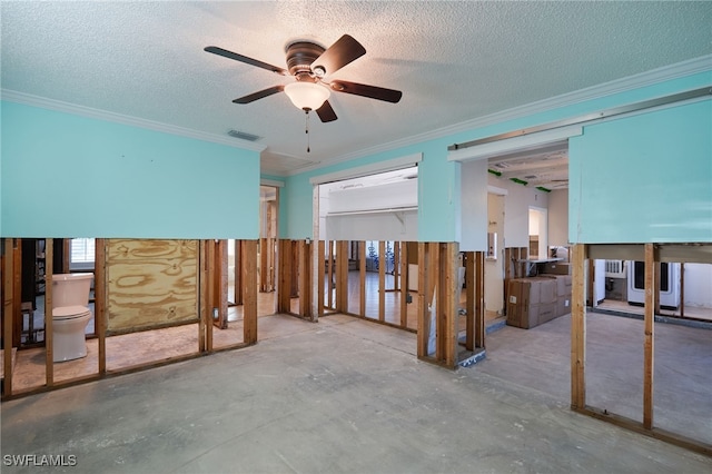 interior space with concrete flooring, a textured ceiling, ceiling fan, and ornamental molding