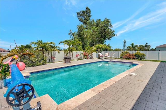 view of swimming pool with a patio area