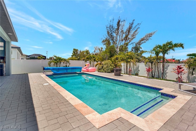 view of swimming pool featuring a patio