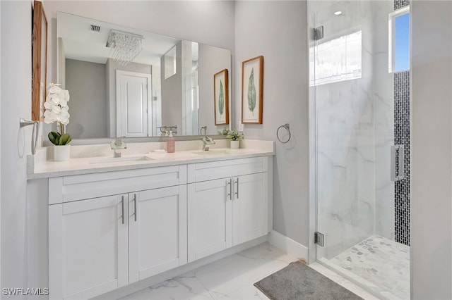 bathroom featuring vanity and a shower with door