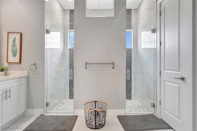 bathroom with vanity and walk in shower