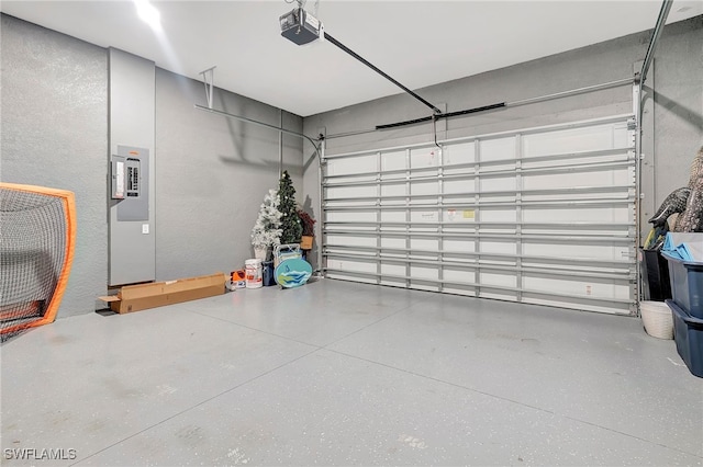 garage featuring electric panel and a garage door opener