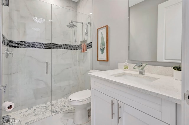 bathroom with vanity, toilet, and an enclosed shower