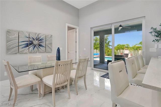 dining space featuring ceiling fan