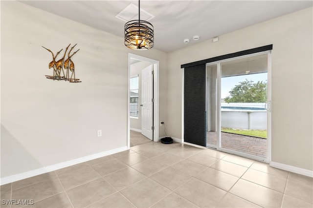 spare room with light tile patterned floors