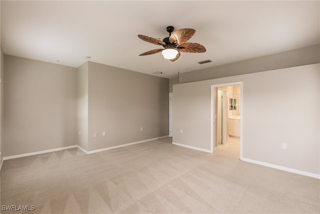 carpeted empty room with ceiling fan