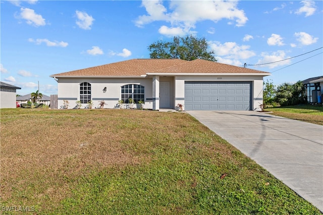 view of front of house with a garage and a front lawn