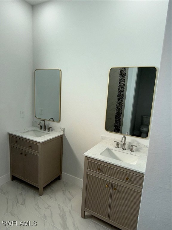 bathroom with vanity and toilet