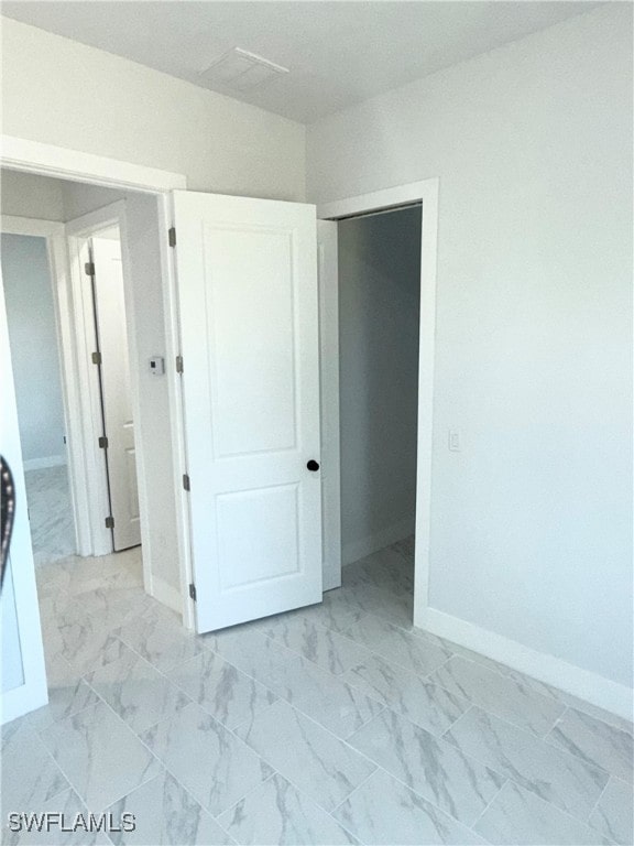 unfurnished bedroom featuring a closet